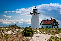 Race Point Light Among Beach Sand and Brush on Cape Cod